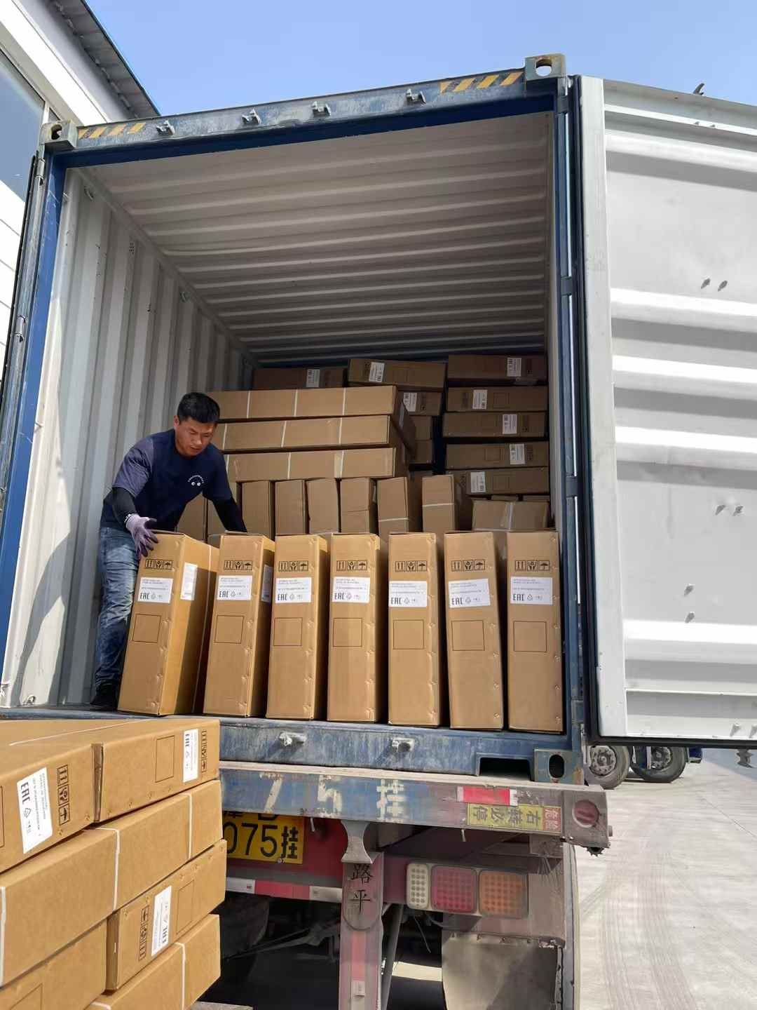 Cartons being loaded into a shipping container