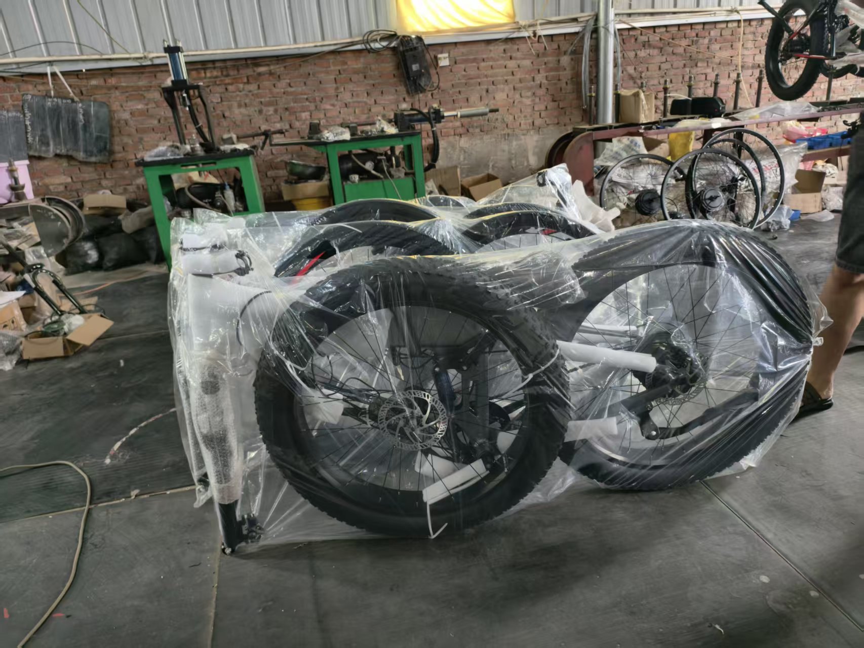 Fat bikes wrapped in protective film ready for packing