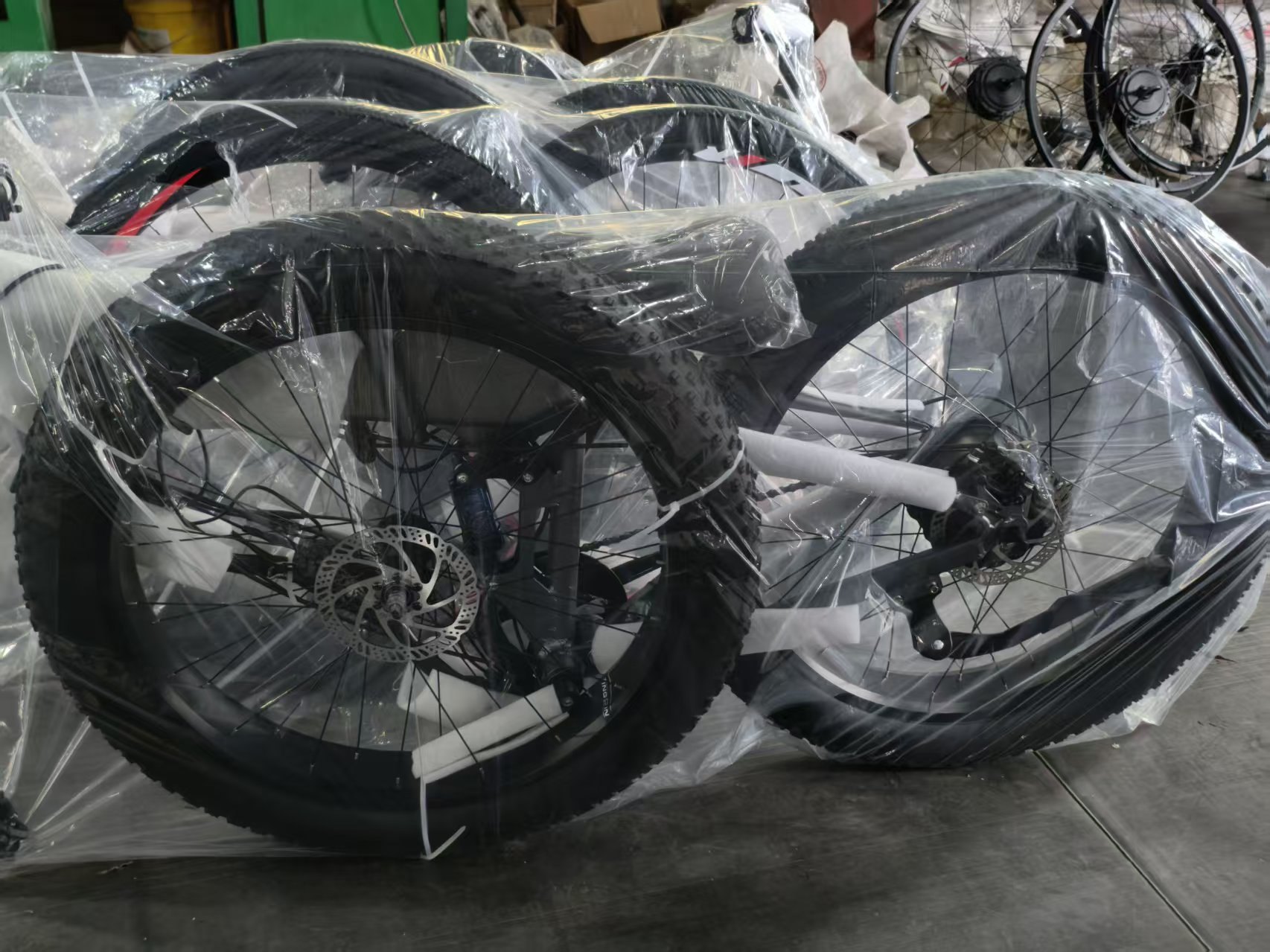 Wrapped wheels and frames prepared for export cartons