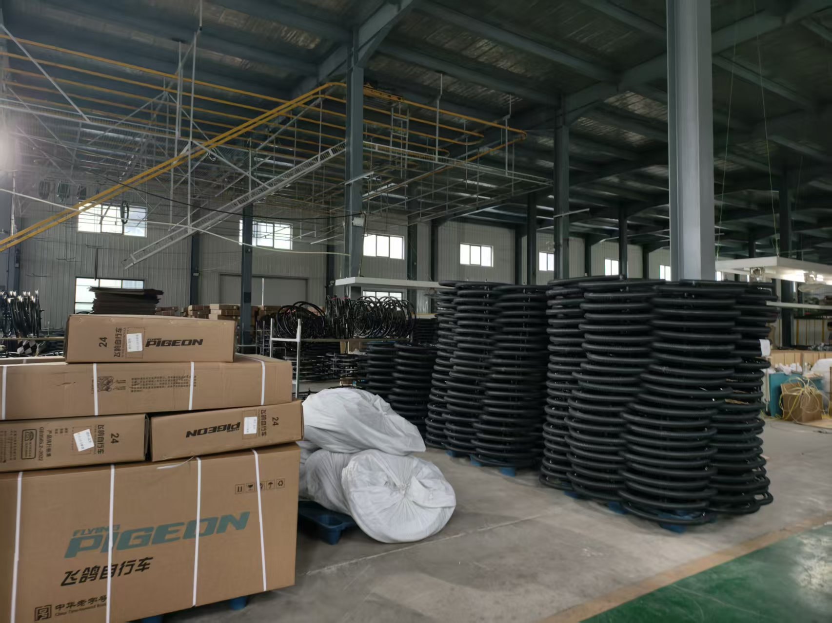 TOJEN factory warehouse with tyre and parts stock